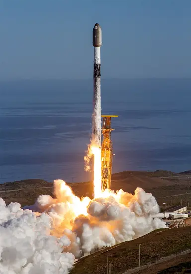 A Falcon 9 lifting off from a coastal launch pad